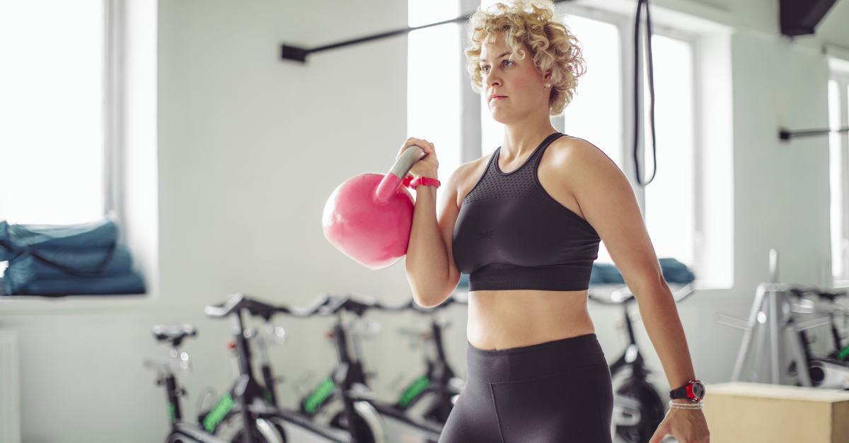 A woman strength training to lose weight and prevent GLP-1 resistance.