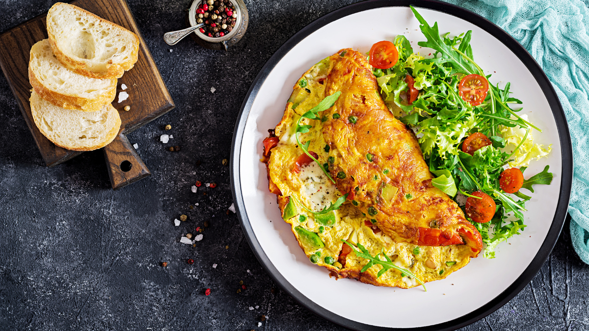 A healthy protein-rich breakfast of GLP-1 friendly eggs and veggies with delicious bread.