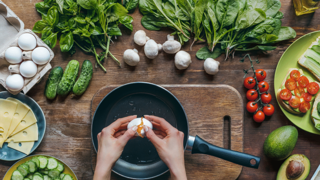 Illustration of a woman cooking a healthy meal in a skillet while in GLP-1 meds