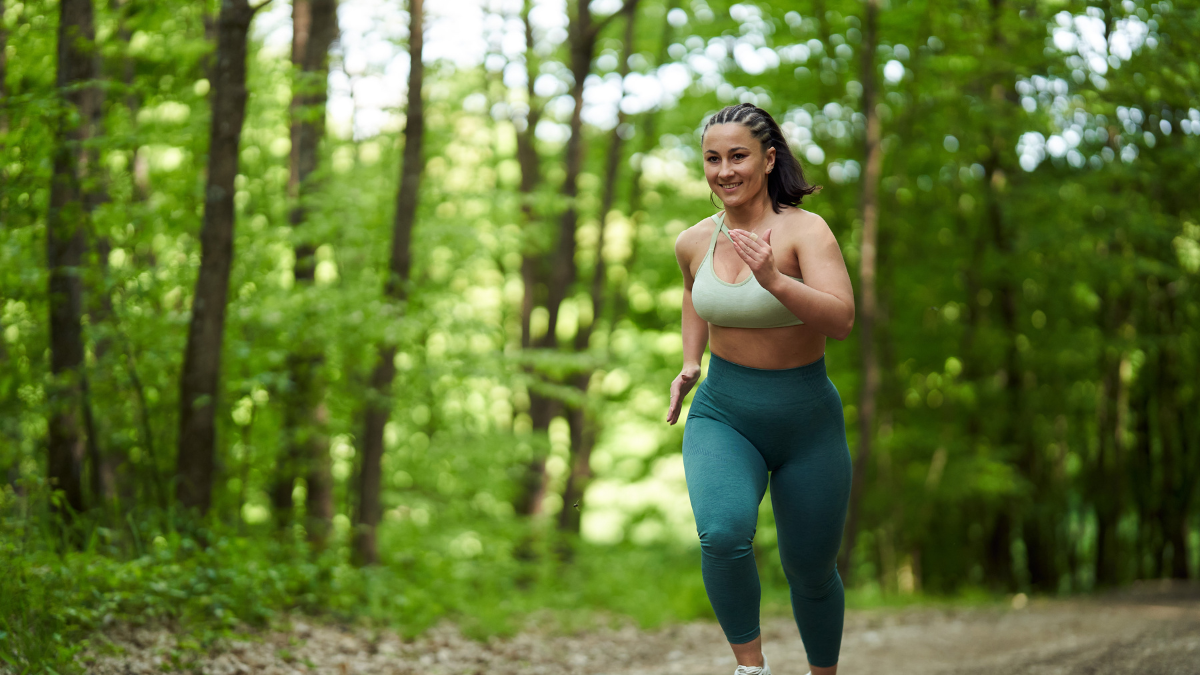 Strong confident woman jogging outdoors