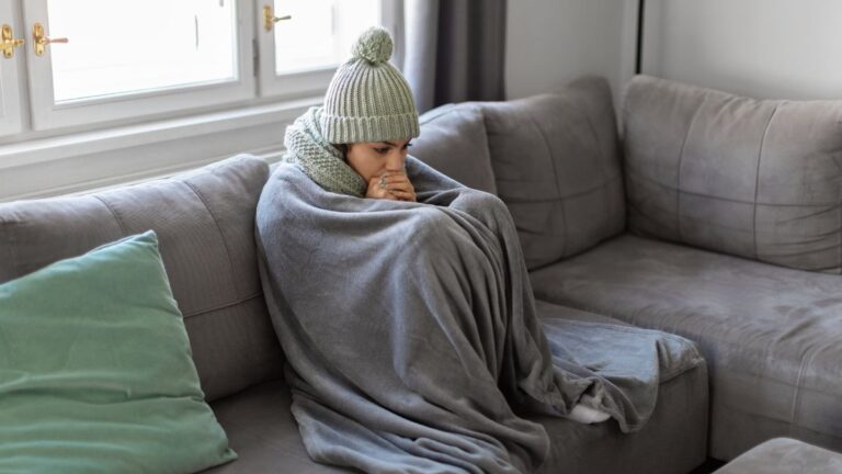 Freezing Woman Covered With Warm Blanket