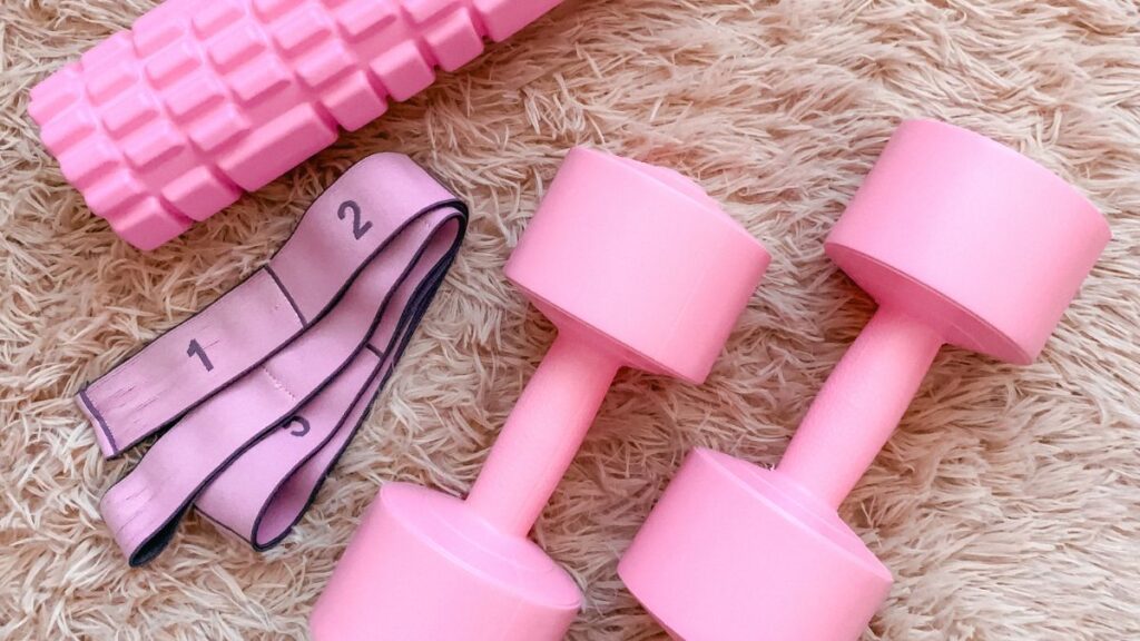 Pink Dumbbells, Roller, and Resistance Band by Julia Baade